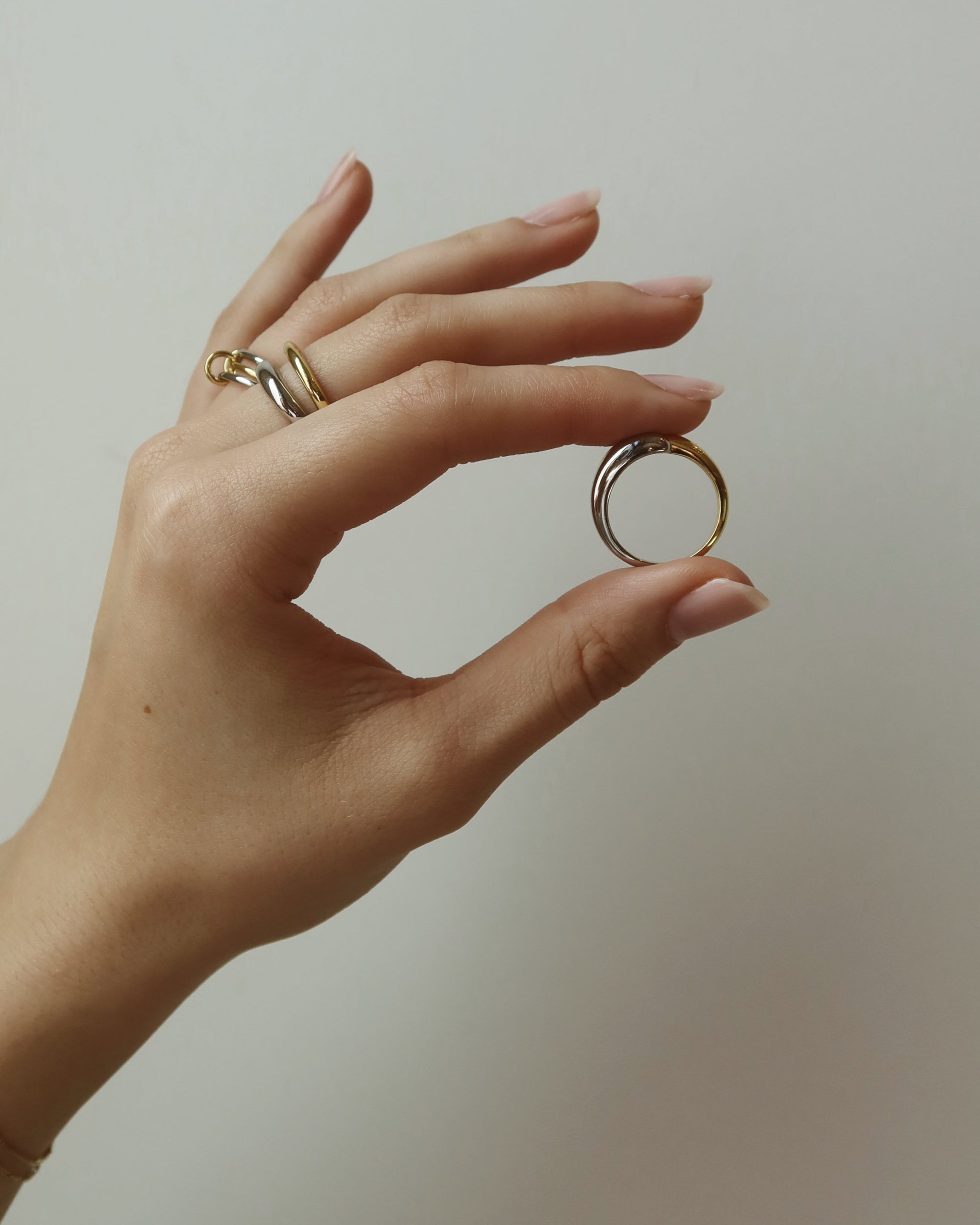 two tone stacking rings in hand | mod + jo