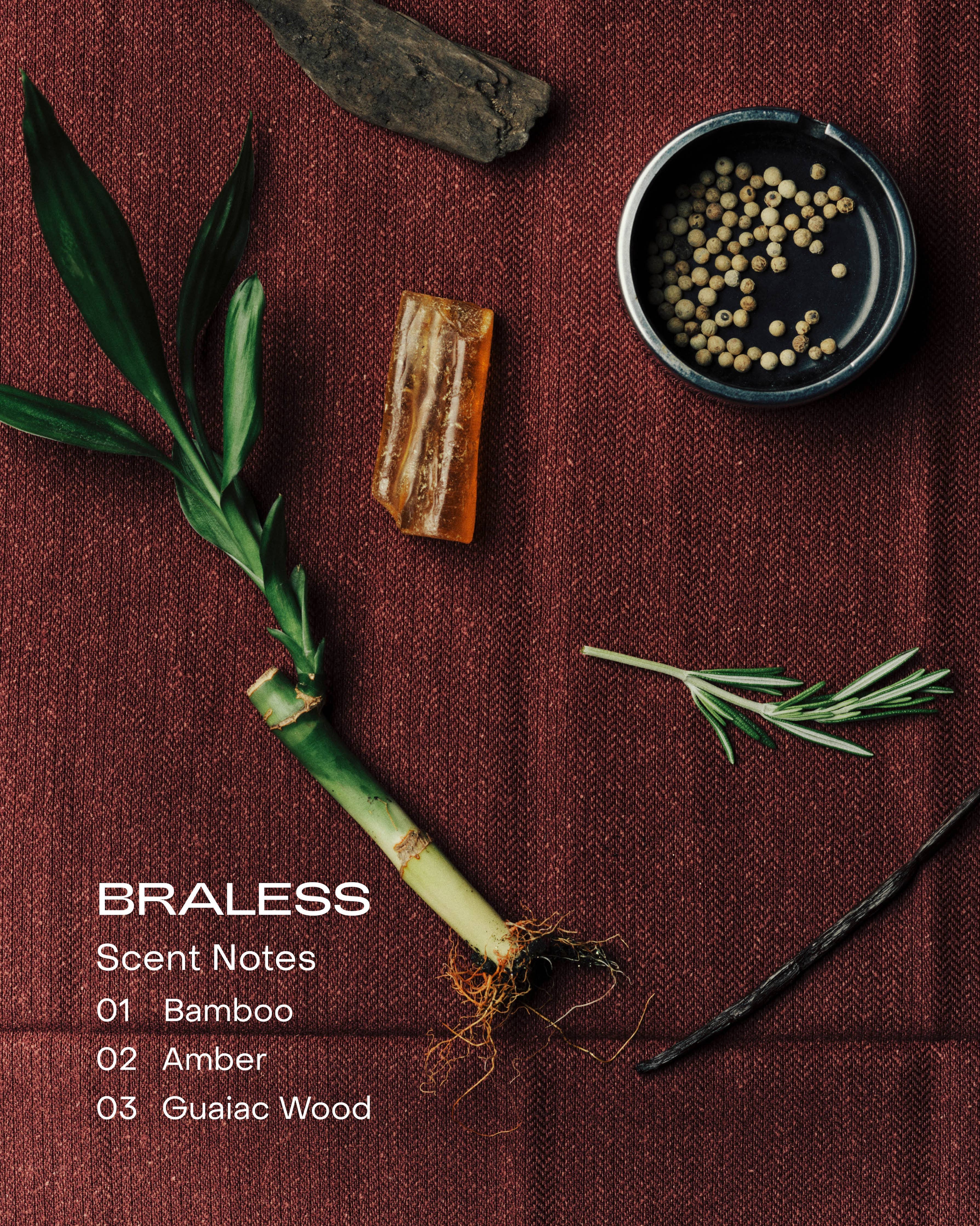 Braless product display with bamboo, amber, and guaiac wood on a brown fabric background