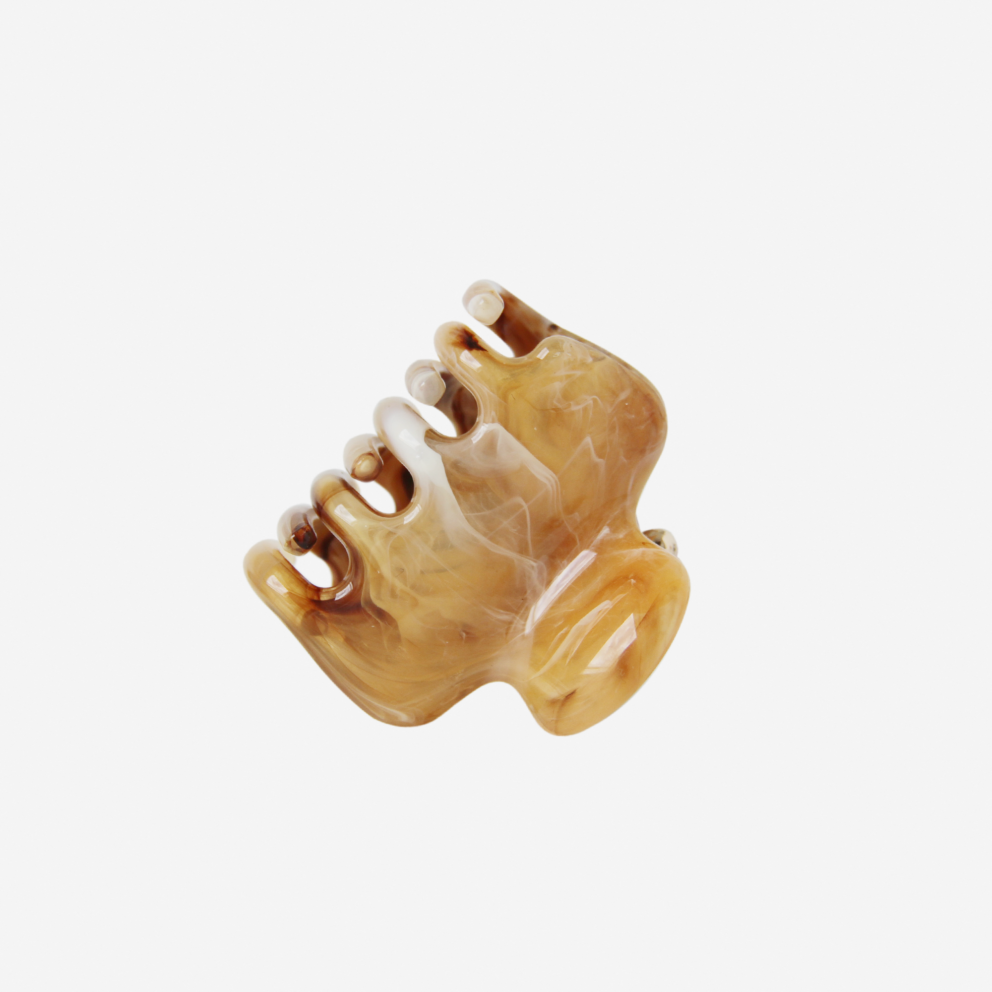 The BRAID & BOW Medium Caramel Swirl Hair Claw features a brown and white marbled design with a curved shape and interlocking teeth, offering a secure and versatile hold. Pictured against a plain white background.