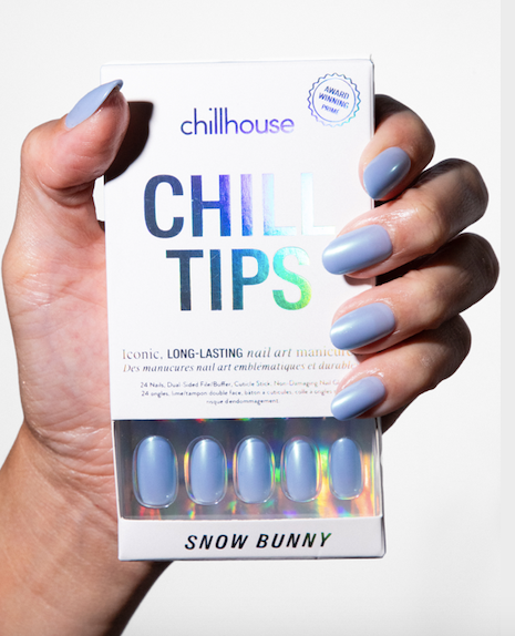 Hand holding a box of 'Chill Tips' with blue nail polish, branded 'Chillhouse'.