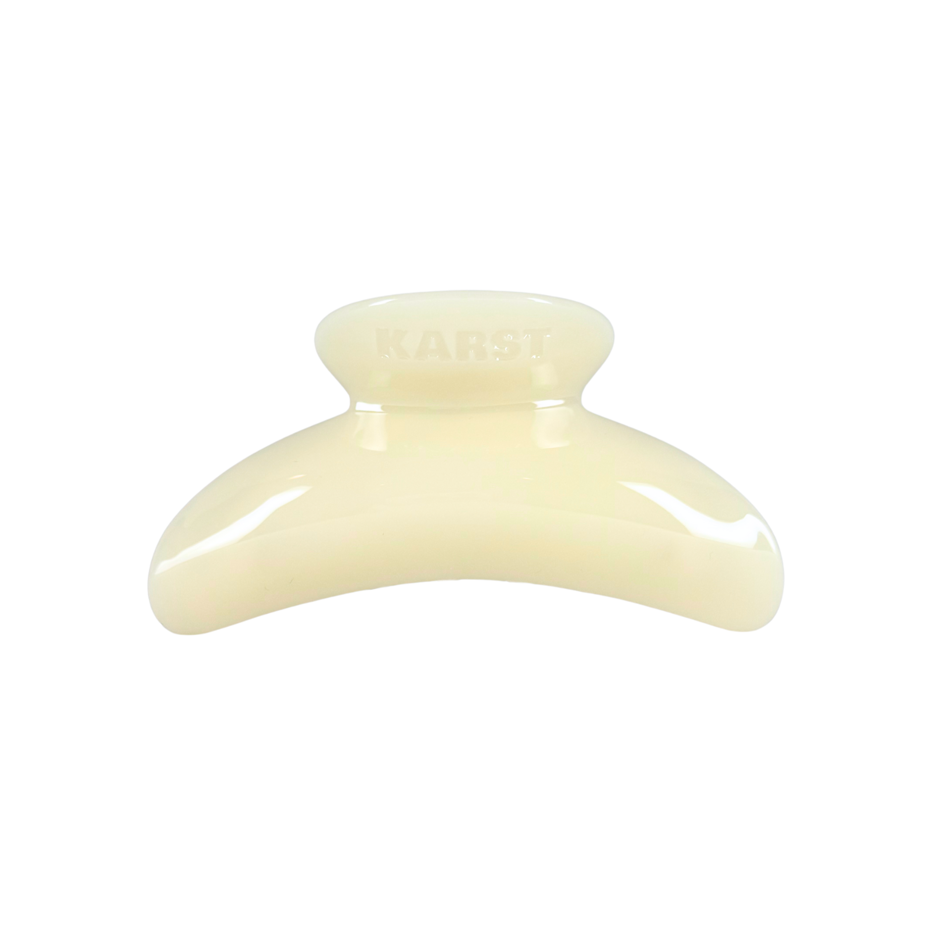 The SuperClip Hair Claw — Buttermilk by Karst Essentials is a cream-colored, curved claw clip made from durable cellulose acetate, featuring "KARST" embossed on top and displayed against a plain white background.