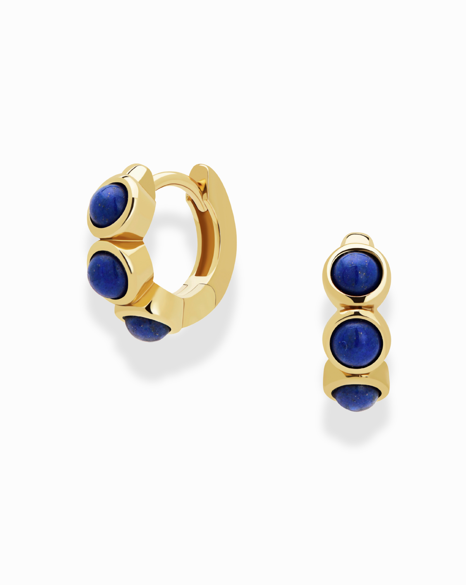 The *Preorder* Corynn Gemstone Huggies by Mod + Jo feature 18k gold plating and showcase three deep blue natural lapis lazuli stones in a vertical row on each earring, photographed against a plain white background.