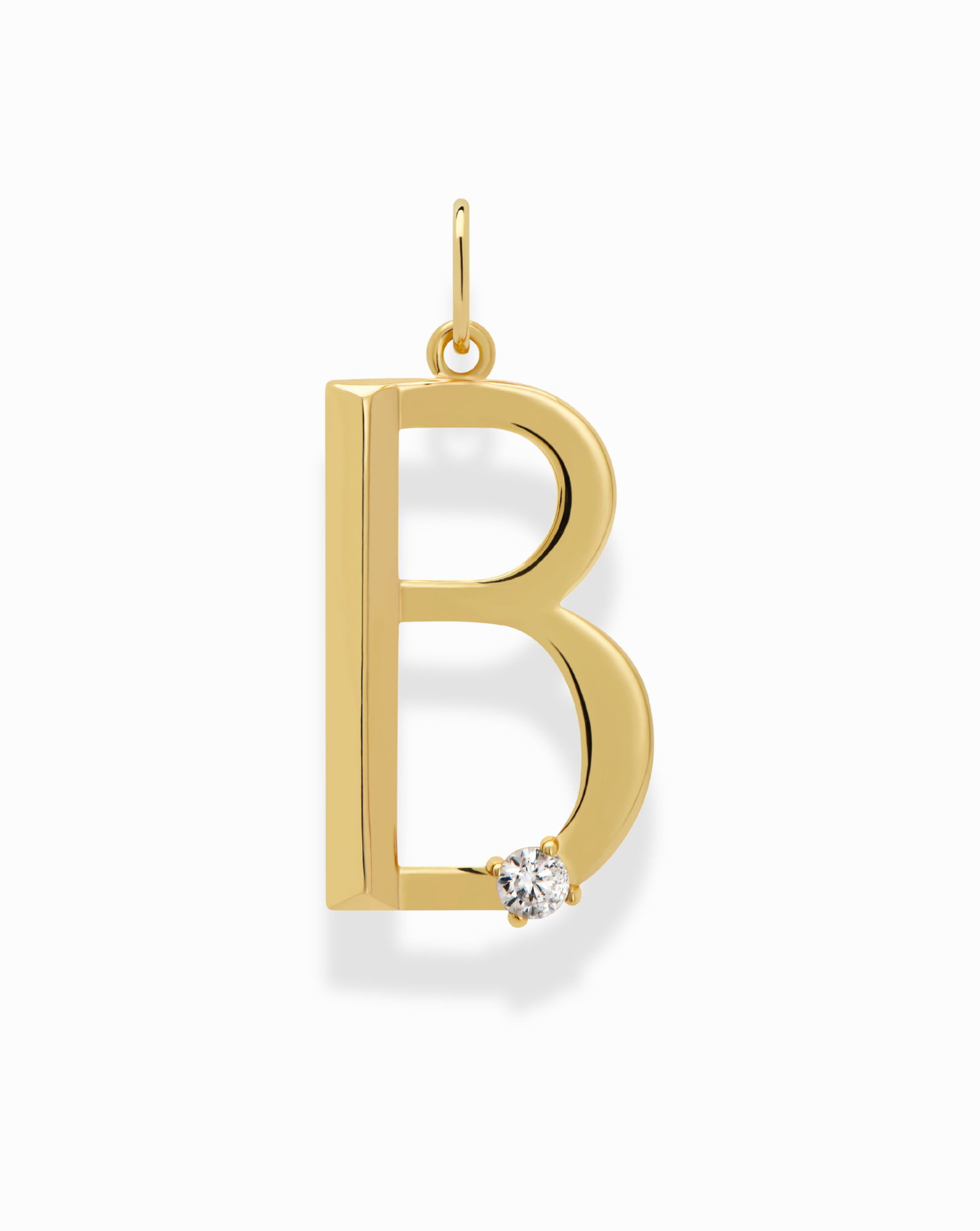 The Eloise Letter Charm by Mod + Jo is a gold-plated “B” initial with a small round white gemstone at the bottom right, elegantly hanging from a petite loop.