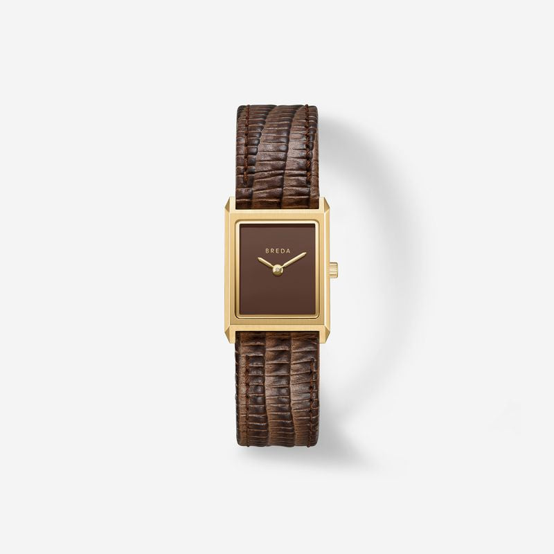 The Virgil Watch Small (Lizard Embossed) by Breda features a rectangular 18K gold-plated case, a minimal brown dial, and a textured wide brown leather band, shown elegantly against a plain white background.