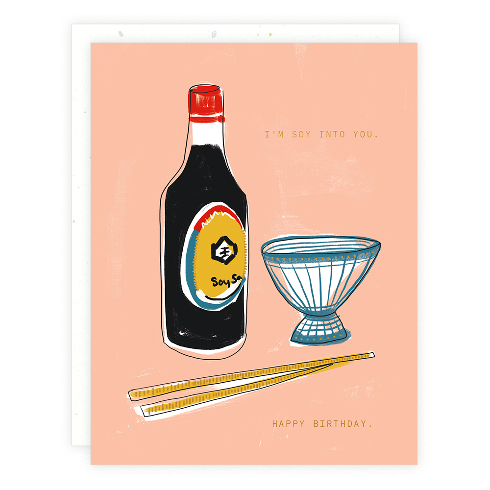 Soy Into You greeting card featuring a bottle of soy sauce, a small bowl, and chopsticks with foil details, displaying the pun I’m soy into you and Happy Birthday.