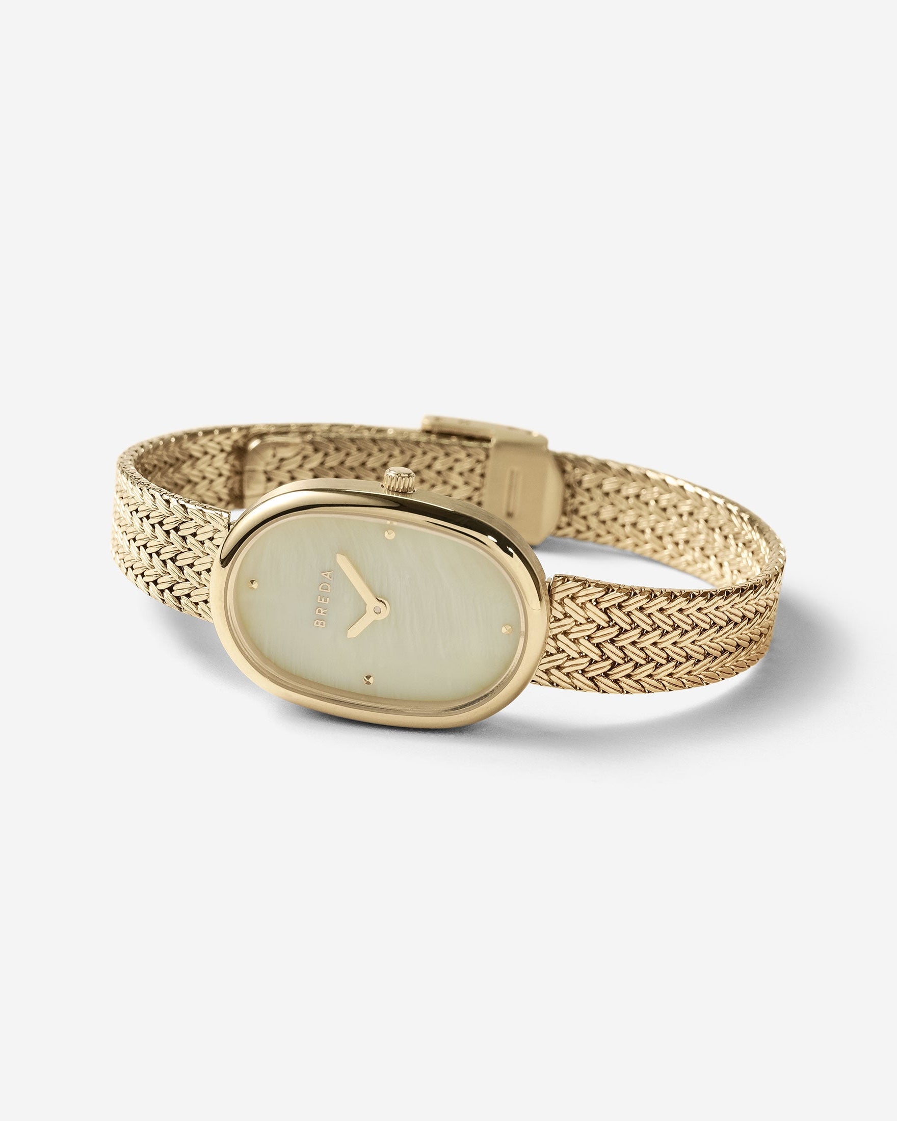 Gold watch with mesh band on a white background