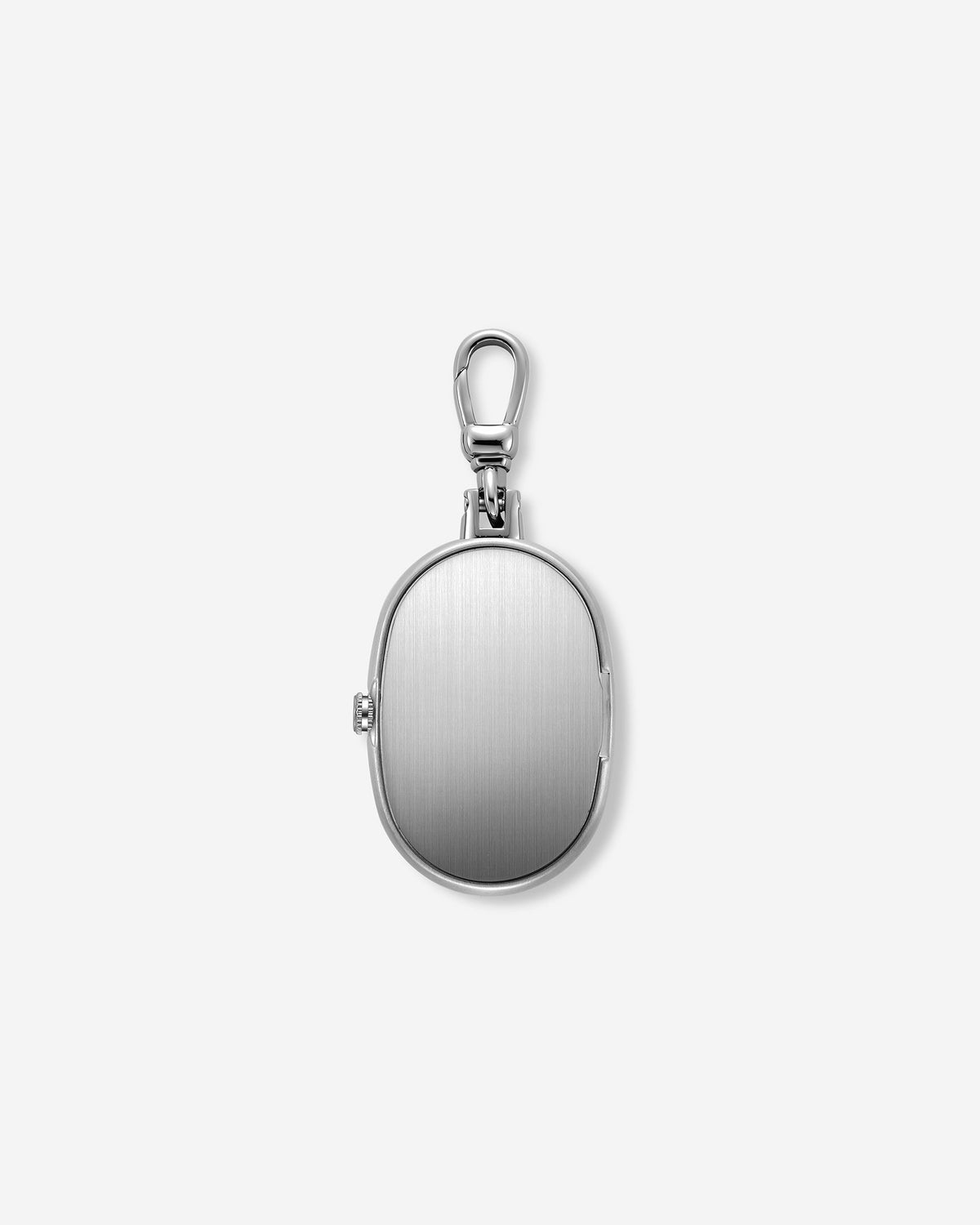 The Jane Time Charm by BREDA features a closed, oval-shaped silver locket with a smooth, brushed finish and a small latch on the side. Attached to a lobster clasp and displayed on a plain white background, this versatile piece from Breda is perfect for pairing with your favorite accessories.