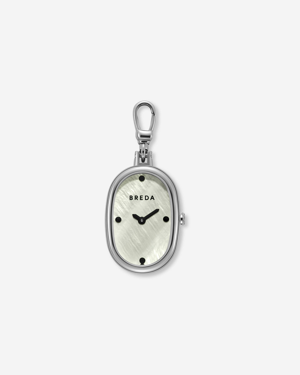 The Jane Time Charm by BREDA is an oval-shaped silver watch pendant featuring a light, textured face reminiscent of mother of pearl, black hour markers, and a sleek silver clasp at the top. This elegant and versatile jewelry piece by Breda is beautifully displayed against a plain white background.
