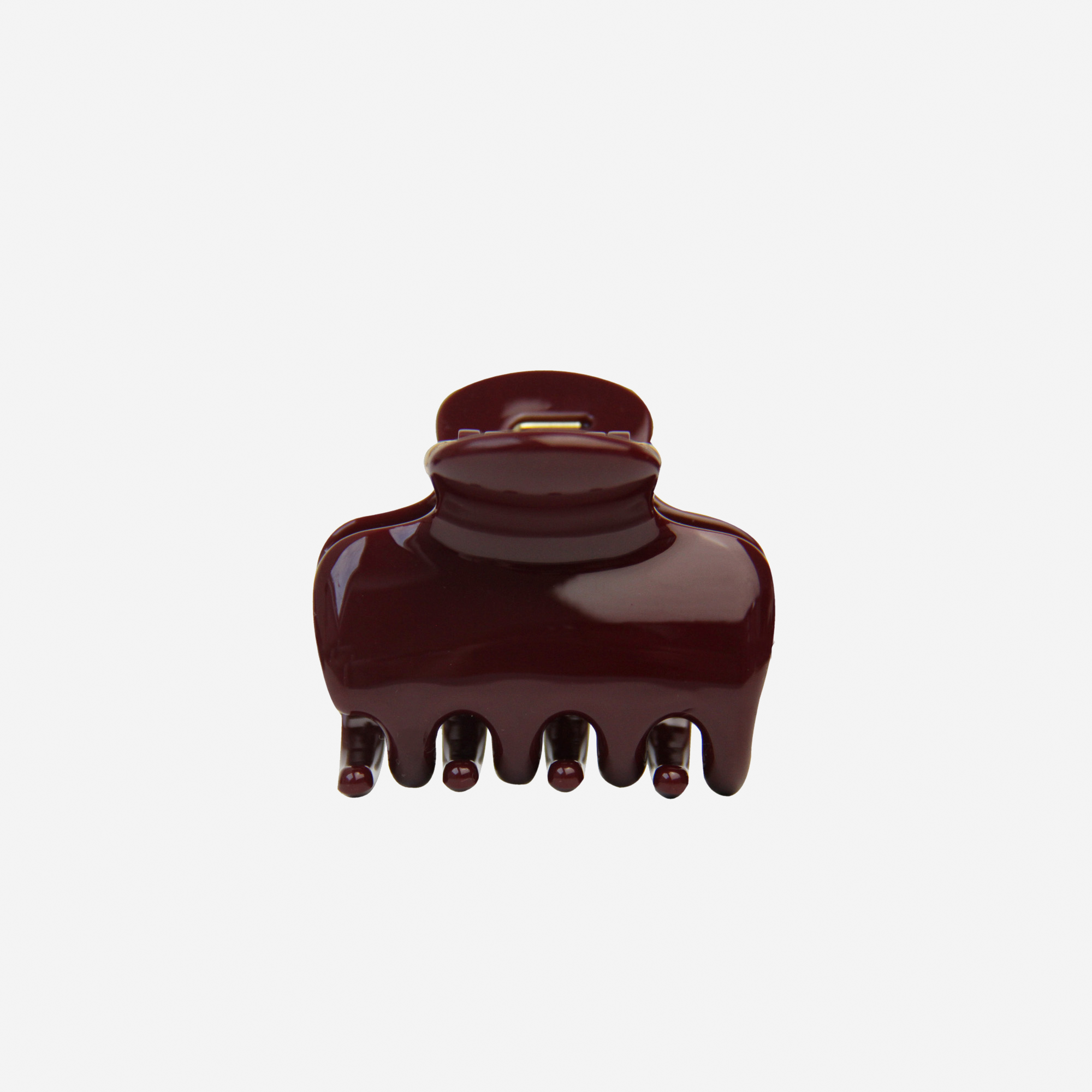 The BRAID &amp; BOW Medium Burgundy Swirl Hair Claw is a stylish, dark maroon hair accessory with a glossy finish and five rounded teeth for a secure hold, beautifully presented against a plain white background.