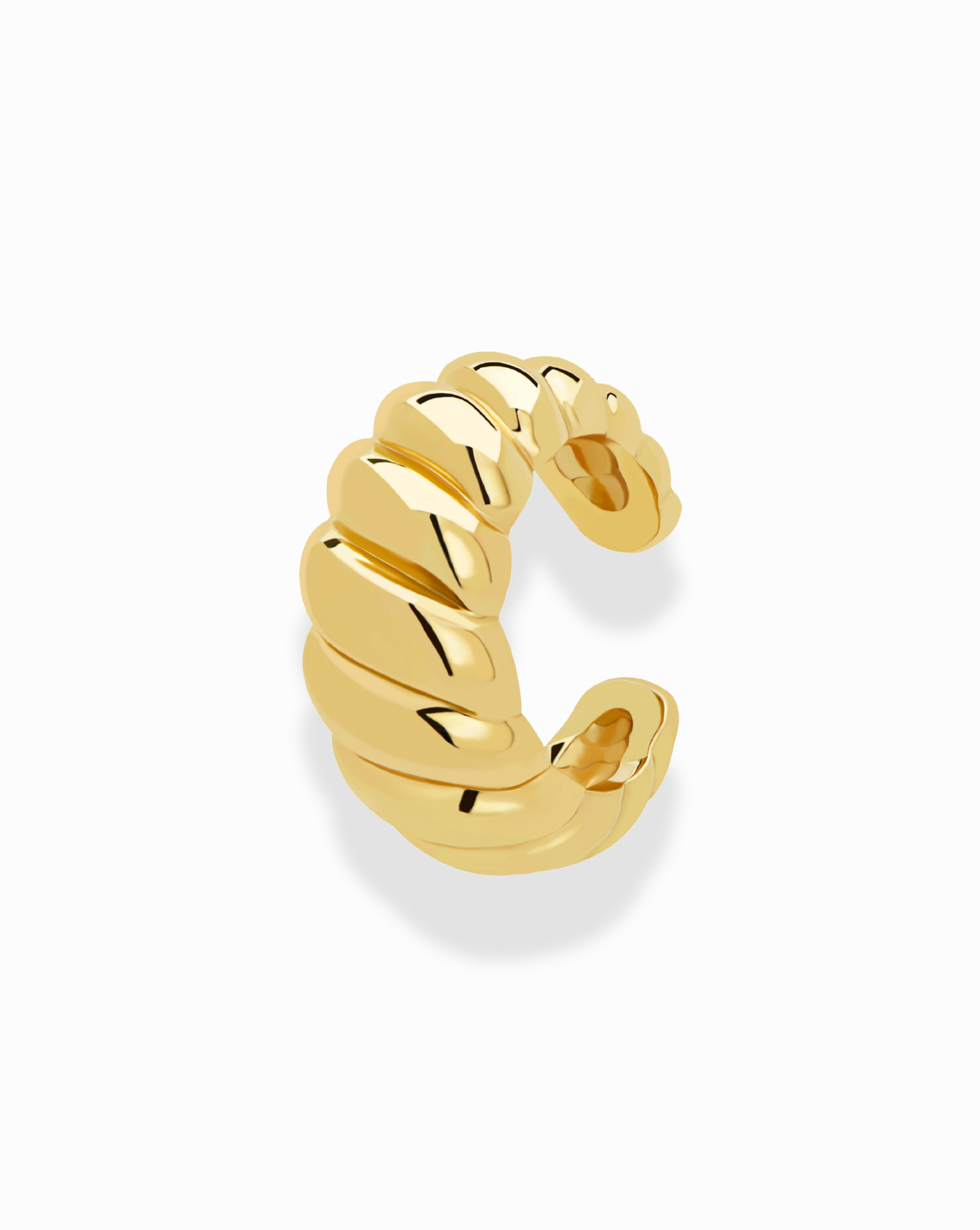 The Mod + Jo Carter Croissant Ear Cuff is a tarnish-free gold ear cuff featuring a thick, twisted ridged design in a C shape, reminiscent of a croissant, shown against a plain white background.