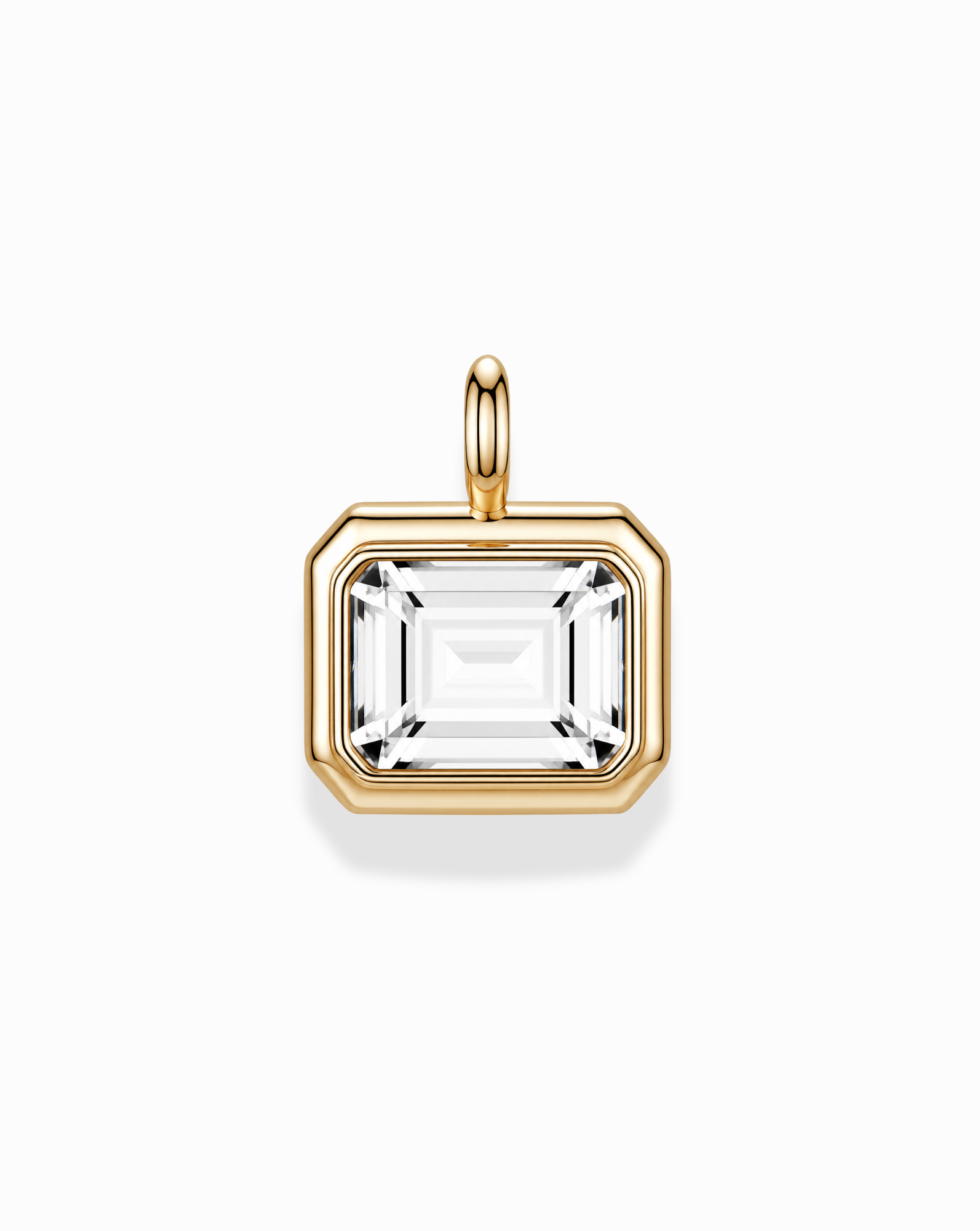 The *Preorder* Elsie Sapphire Bezel Charm by Mod + Jo features a rectangular, emerald-cut lab-grown white sapphire set in a 14k gold over brass frame with a simple gold loop, shown on a white background.