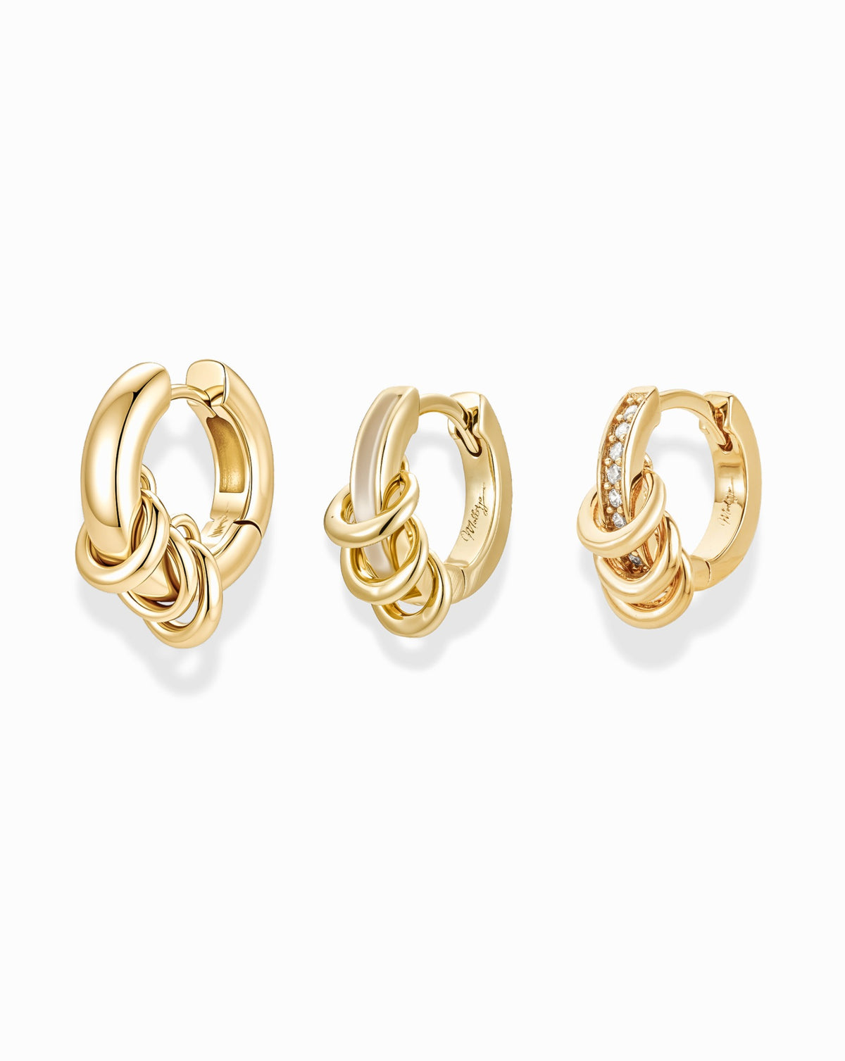 Three gold Levi Huggies Gift Set earrings, each featuring a cluster of linked rings, with the rightmost earring accented by a row of small stones.