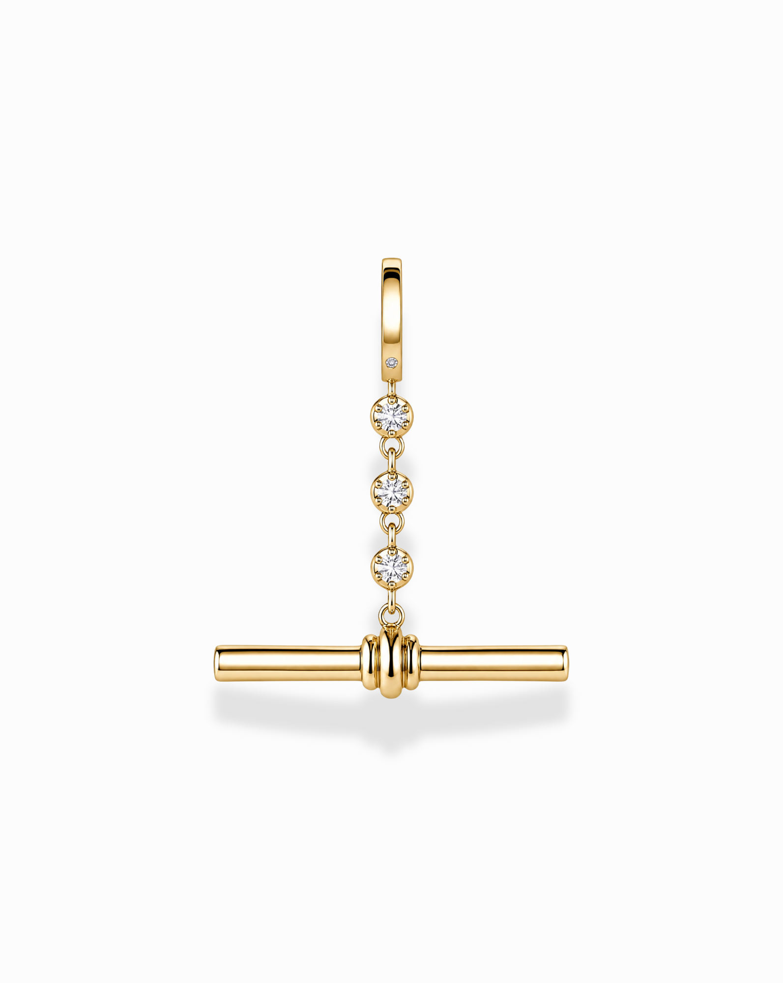The Mod + Jo Livia Tennis Toggle Charm is a gold-plated jewelry pendant featuring three small diamonds set vertically, with a horizontal gold bar suspended below, shown against a white background.