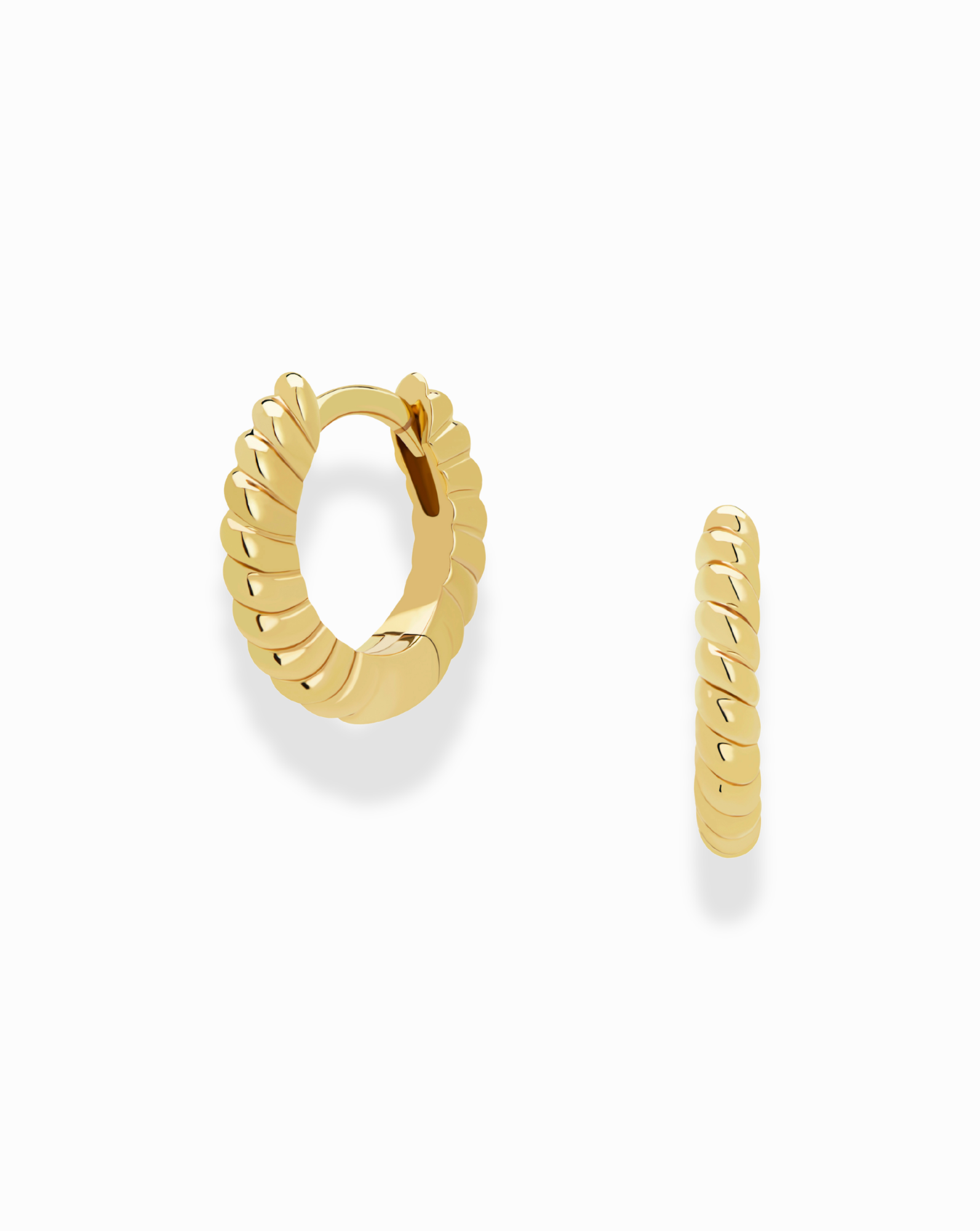 The Petite Margaux Stacking Hoops by Mod + Jo are small gold, tarnish-resistant earrings with a twisted, ridged design, shown on a white background—one hoop faces forward while the other is displayed in profile.