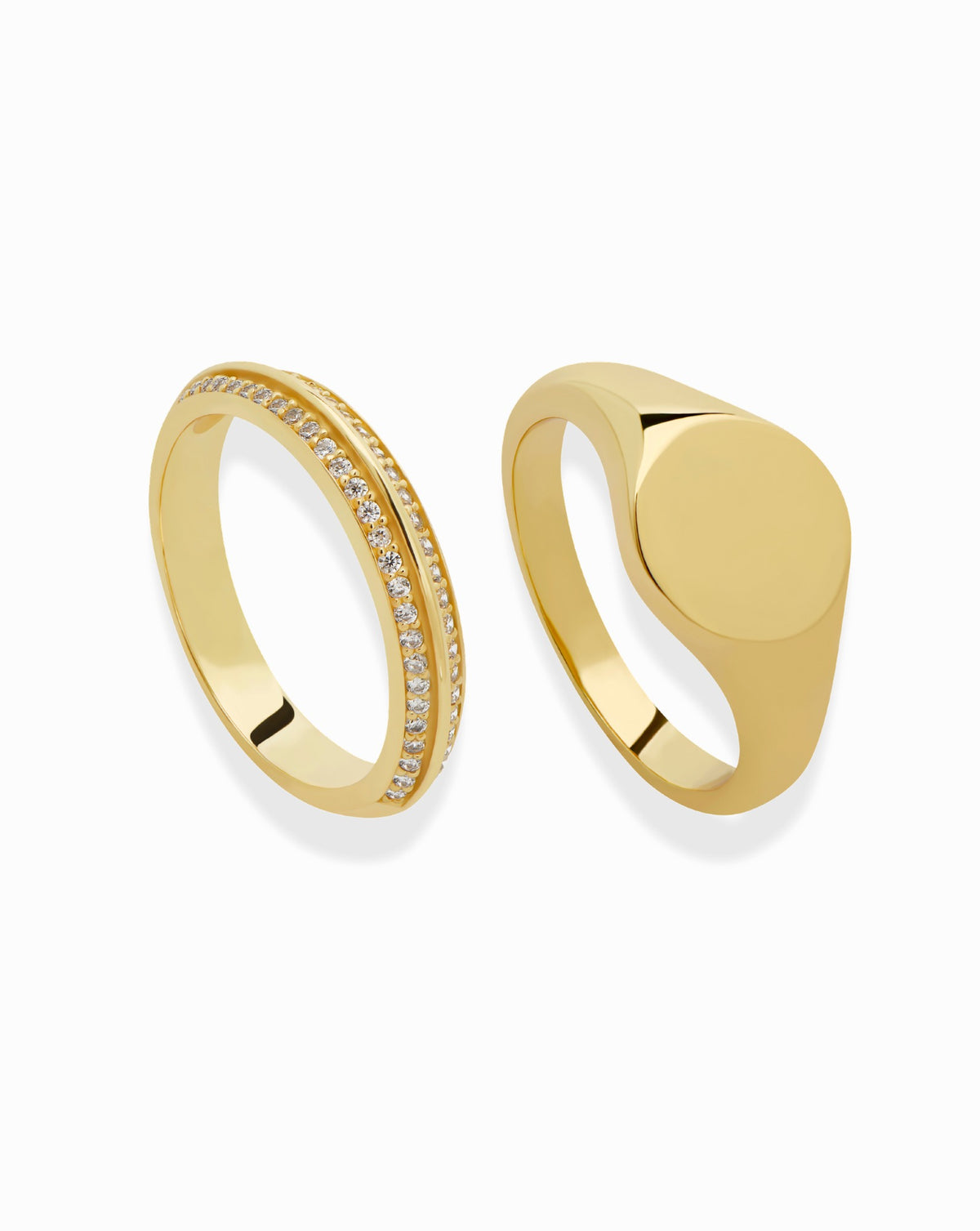 The Mariah + Tessa Set featuring a Mariah pavé band set with a row of small stones next to a plain gold signet ring.