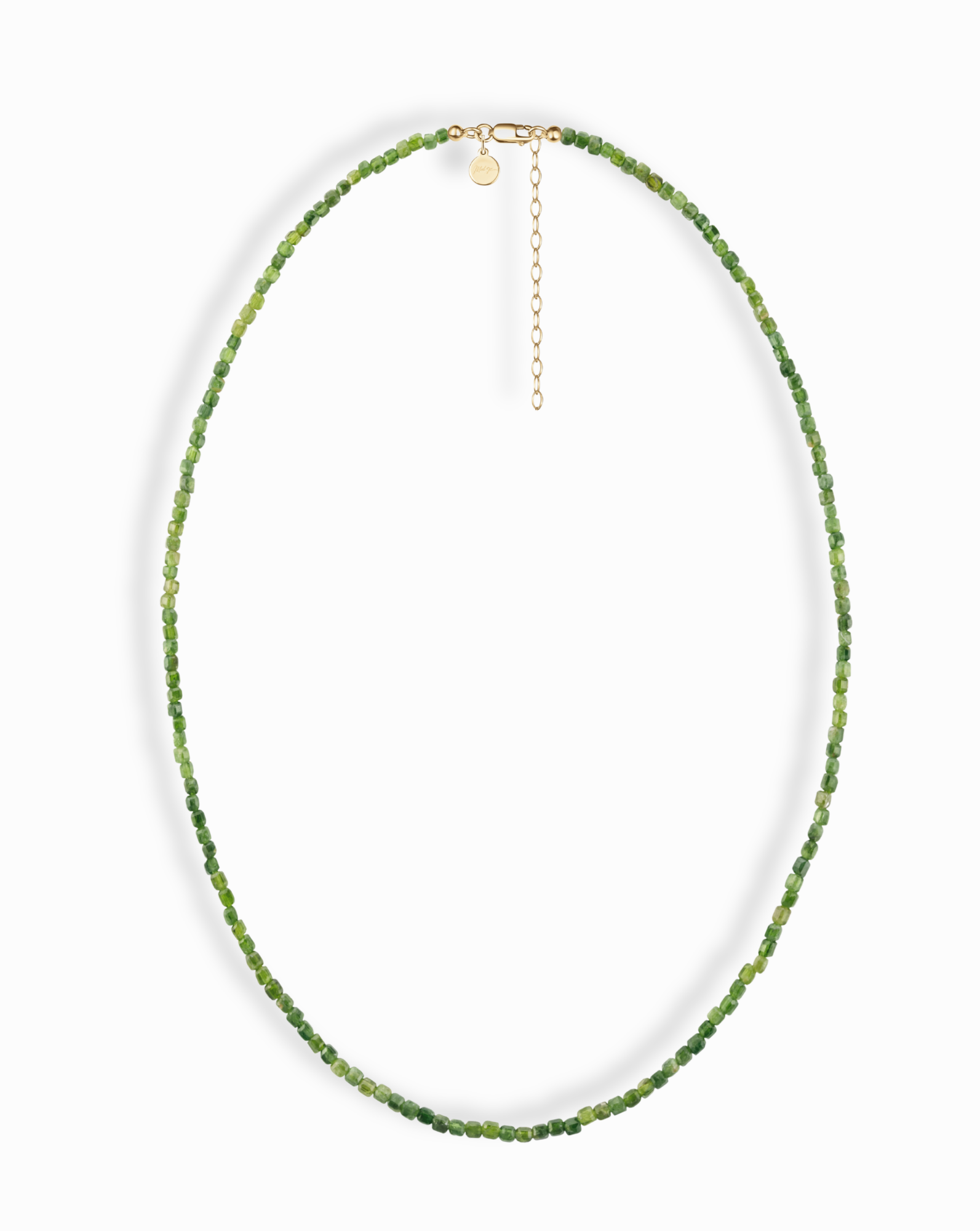 The Mod + Jo Merit Gemstone Necklace features small, faceted green beads in a single strand with a 14k gold-filled clasp and extender chain, shown on a white background.