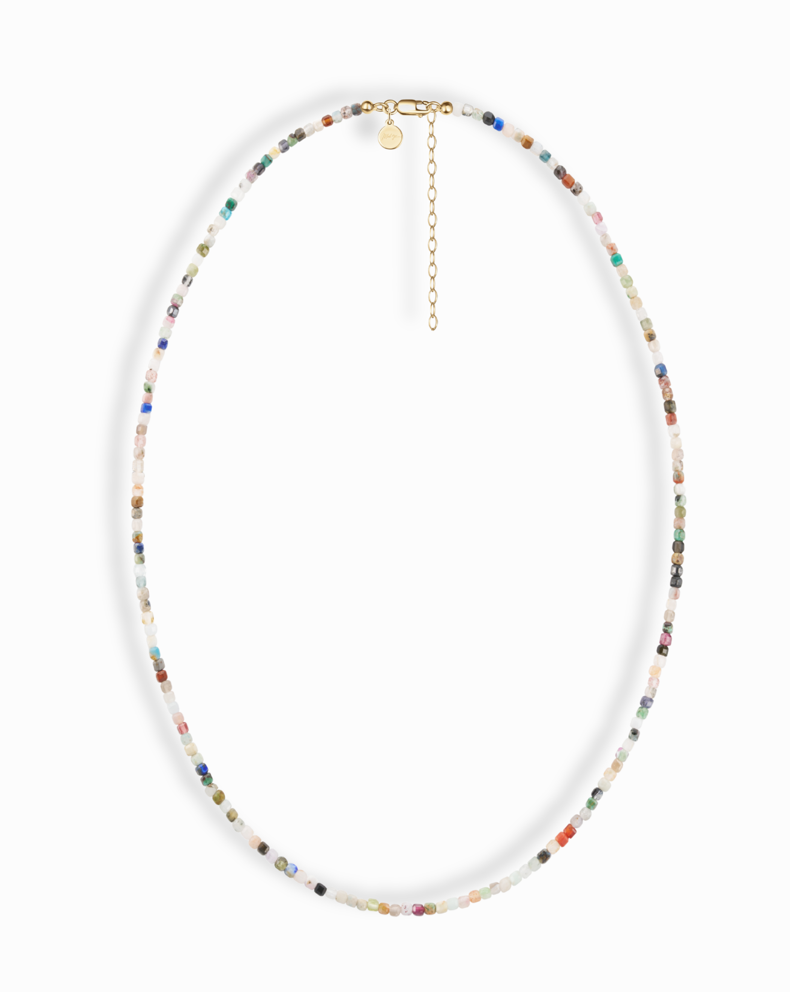 The Mod + Jo Merit Gemstone Necklace features small, multicolored beads, a gold clasp, short extension chain, and round charm. Handmade in Dallas and displayed on a white background.