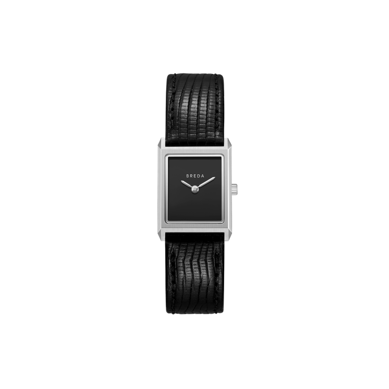 The Virgil Watch Small (Lizard Embossed) by Breda is a rectangular vintage timepiece with a black textured leather band, black face, silver frame, minimalist silver hands, and the BREDA name on the dial.