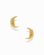 The Archie Moon Studs by Mod + Jo are a pair of gold plated earrings, each adorned with a delicately carved crescent moon face. Displayed on a white background, these whimsical studs make an enchanting addition to any celestial jewelry collection.