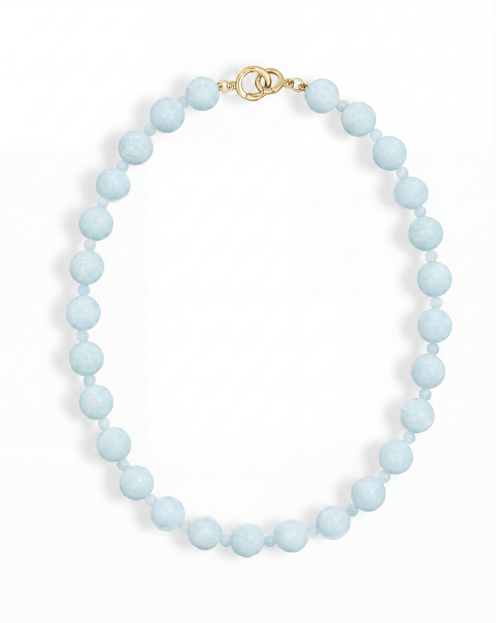 The Portia Gemstone Necklace by Mod + Jo features a single strand of round, light blue natural aquamarine beads with a gold clasp, displayed on a white background.