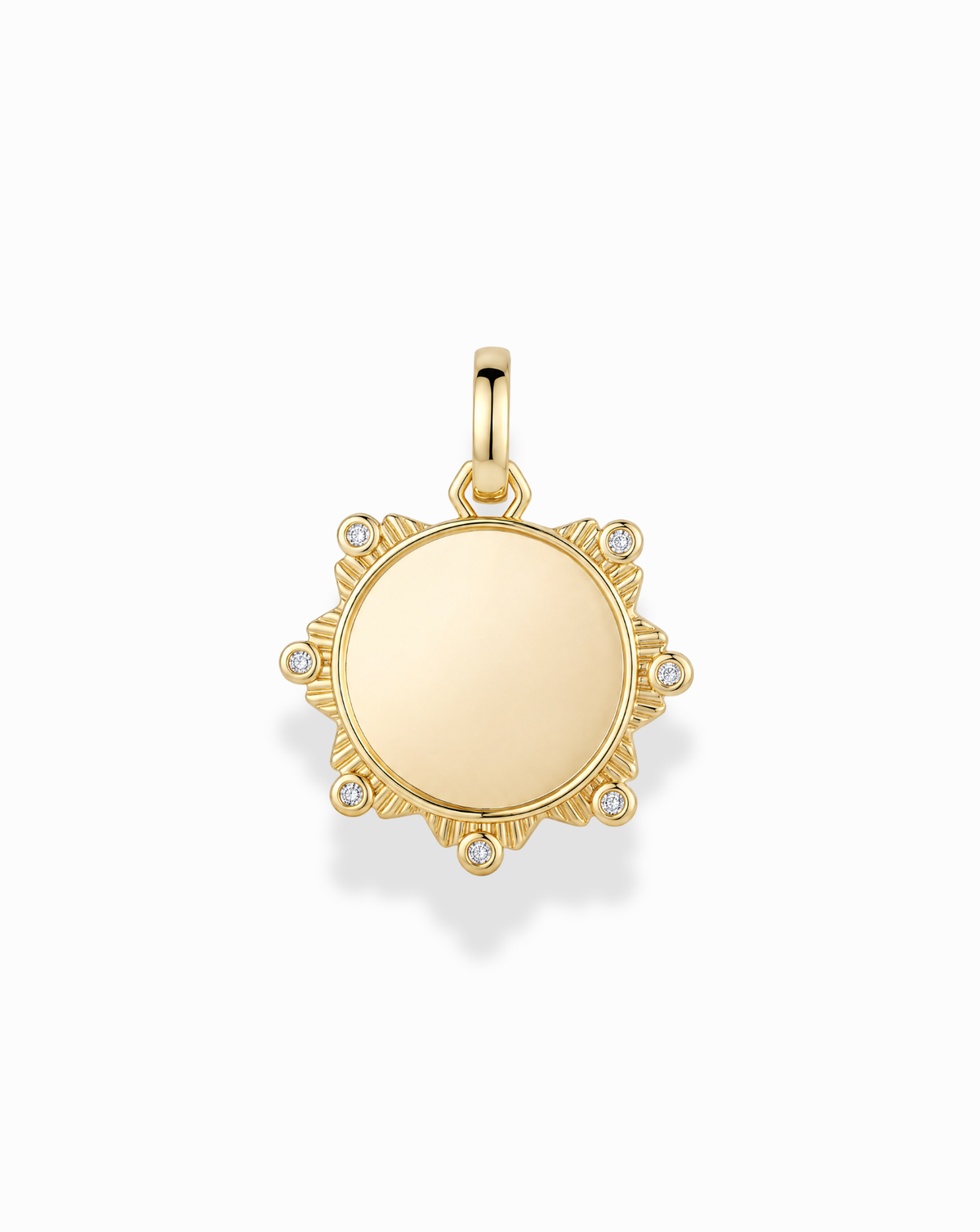 Mod + Jo Remi Engravable Charm: a gold-plated sunburst pendant featuring a smooth, engravable circular center and six small inset stones along the outer edge.