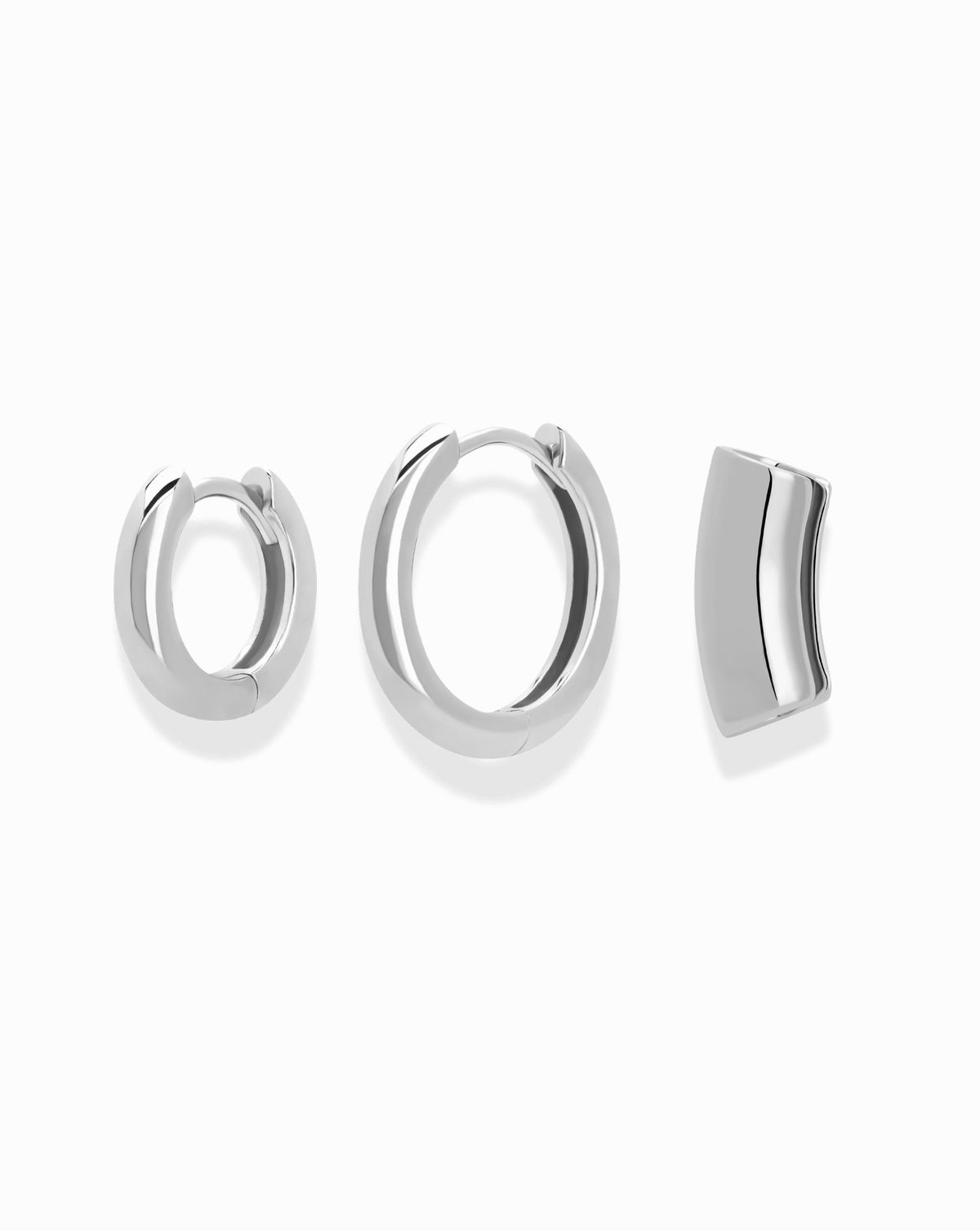 The Reneé + Lennon Set featuring two silver smooth huggies and a single curved silver helix ear cuff.