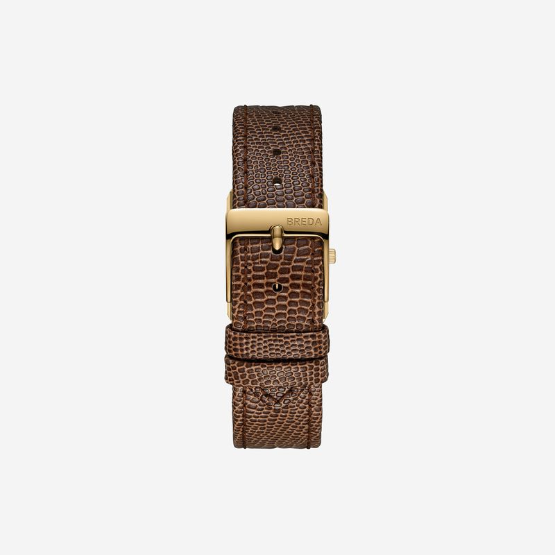 A close-up of the BREDA Virgil Watch Small (Lizard Embossed) highlights its brown textured leather band and gold-plated buckle engraved with BREDA, displaying elegant 18K gold plating against a plain white background.