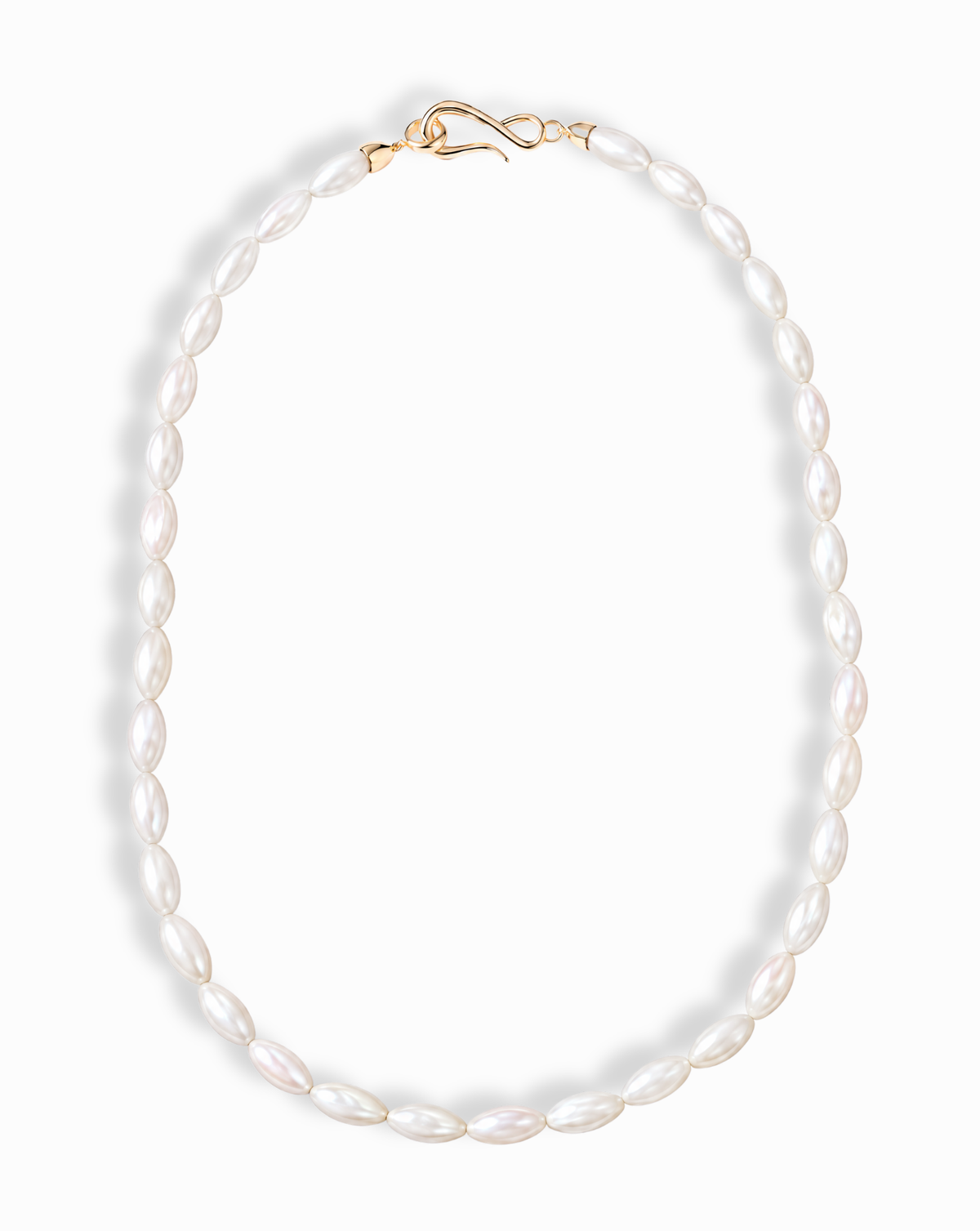 Sutton Gemstone Necklace: 18″ necklace featuring oval-shaped, rice-style freshwater pearls finished with a gold clasp.