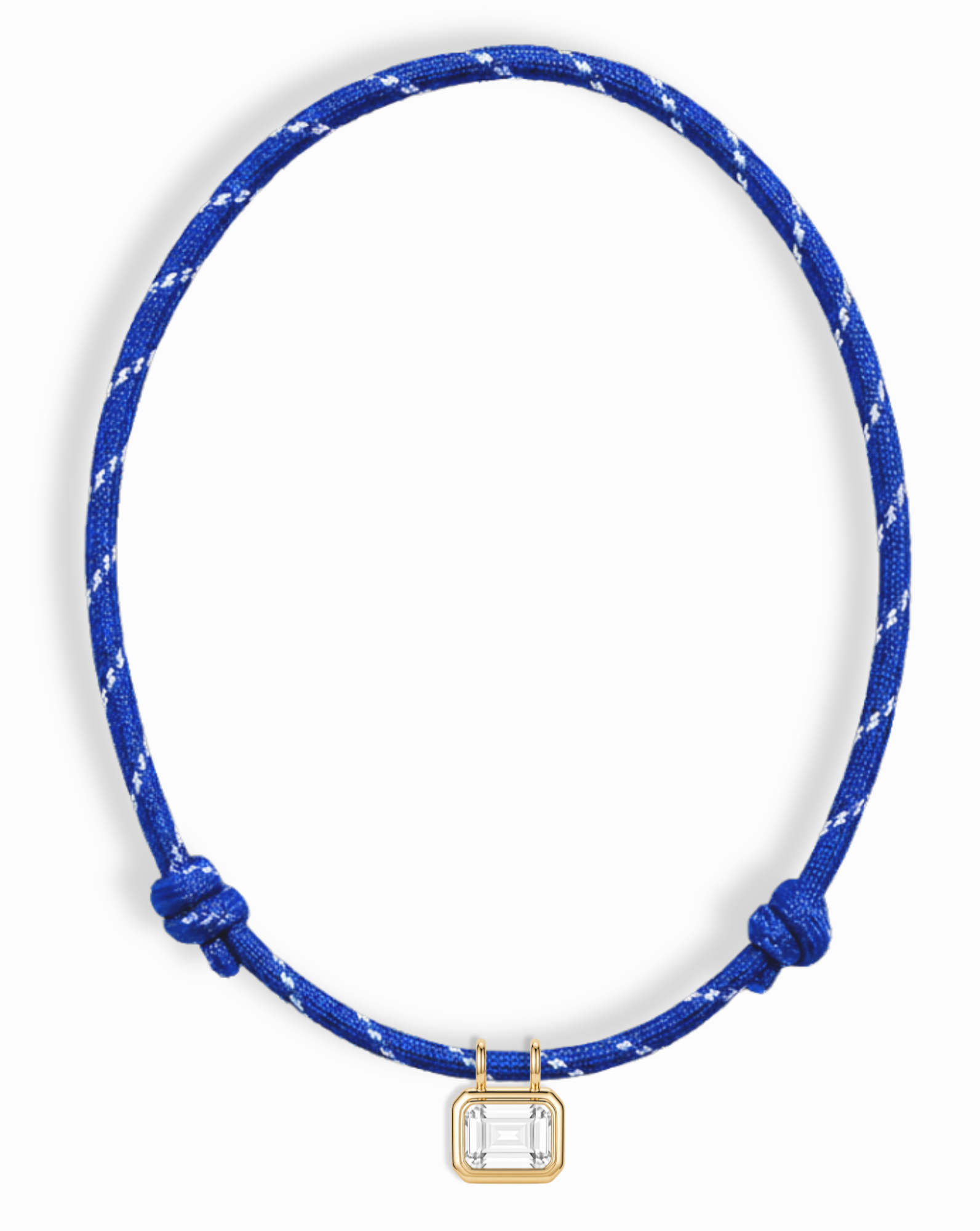 The *Preorder* Tommy Sapphire Pendant Necklace by Mod + Jo features a blue cord, white accents, gold bezel-set rectangular pendant, and clear gemstone center.