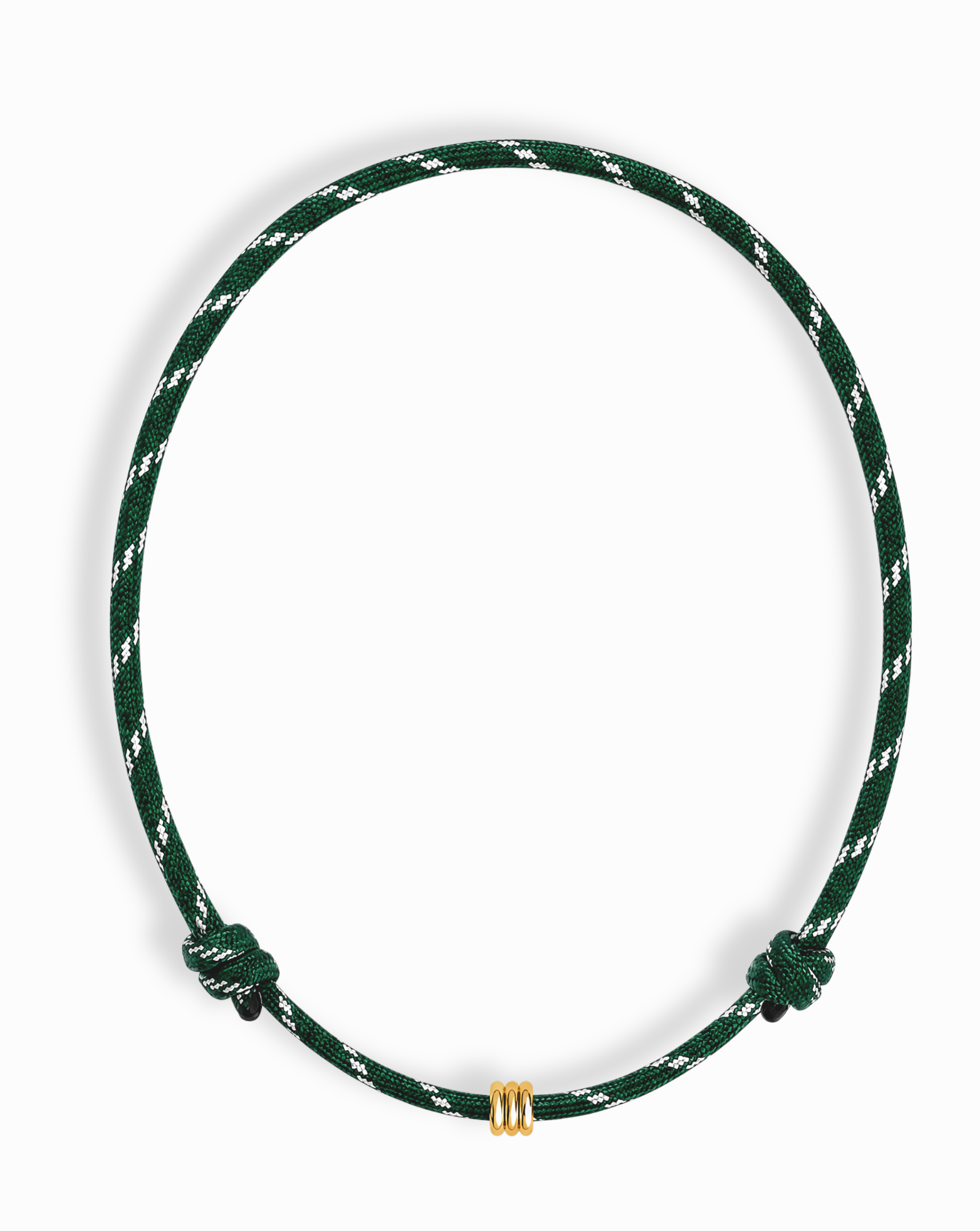 The Tommy Cord Necklace by Mod + Jo showcases a green and white braided paracord accented with gold-plated spacers, featuring two symmetrically positioned knots on each side for added detail. This adjustable piece combines style and versatility, making it a distinctive accessory to elevate any outfit.