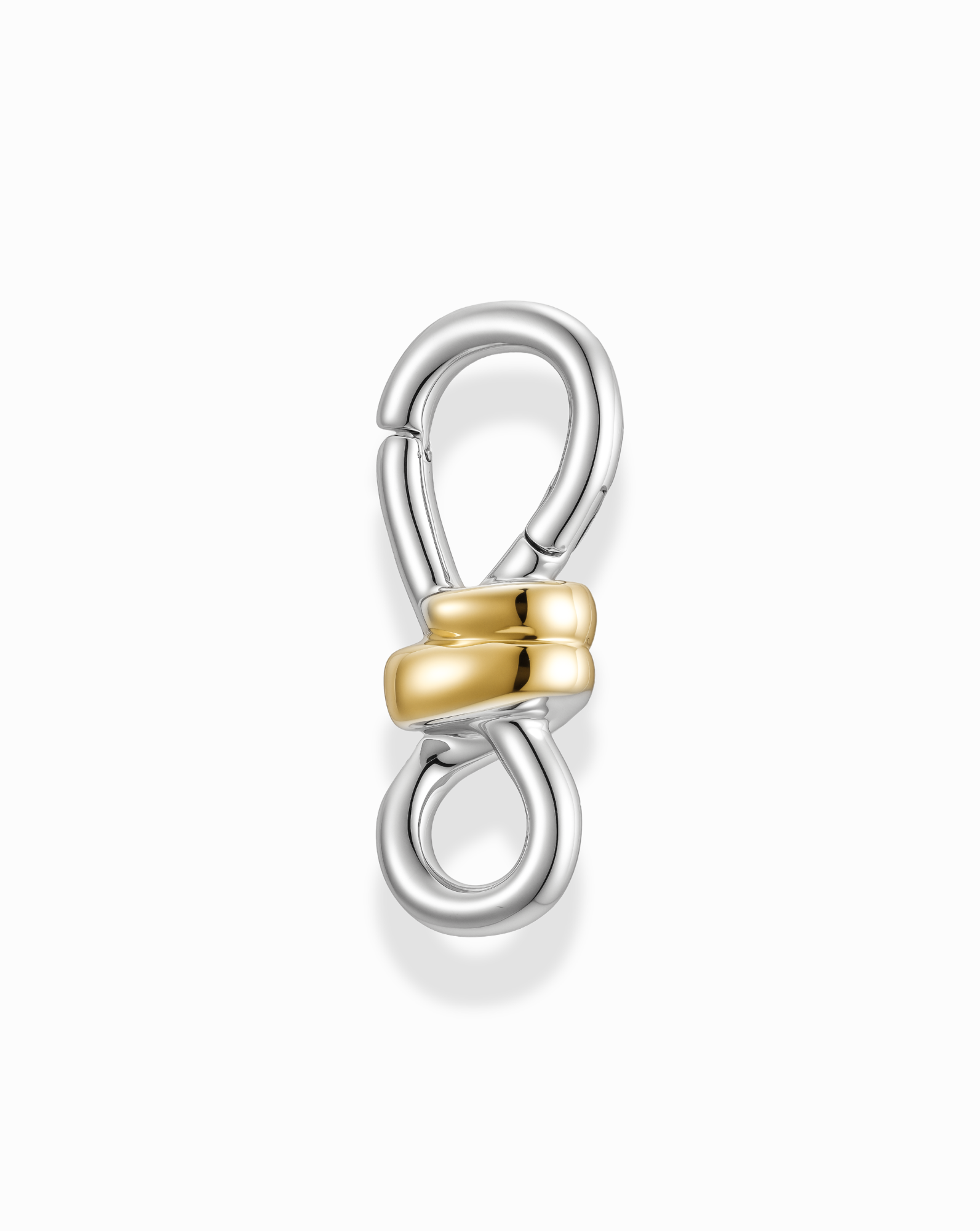 The Izzy Knot Charm Enhancer by Mod + Jo features a silver metal figure-eight clasp, highlighted by two intertwined 14k gold-plated loops at the center, displayed on a white background.